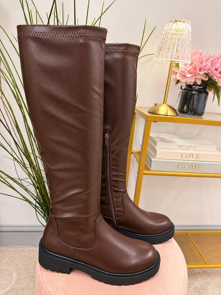 The NICOLA chocolate brown flat knee high stretch calf faux leather boots