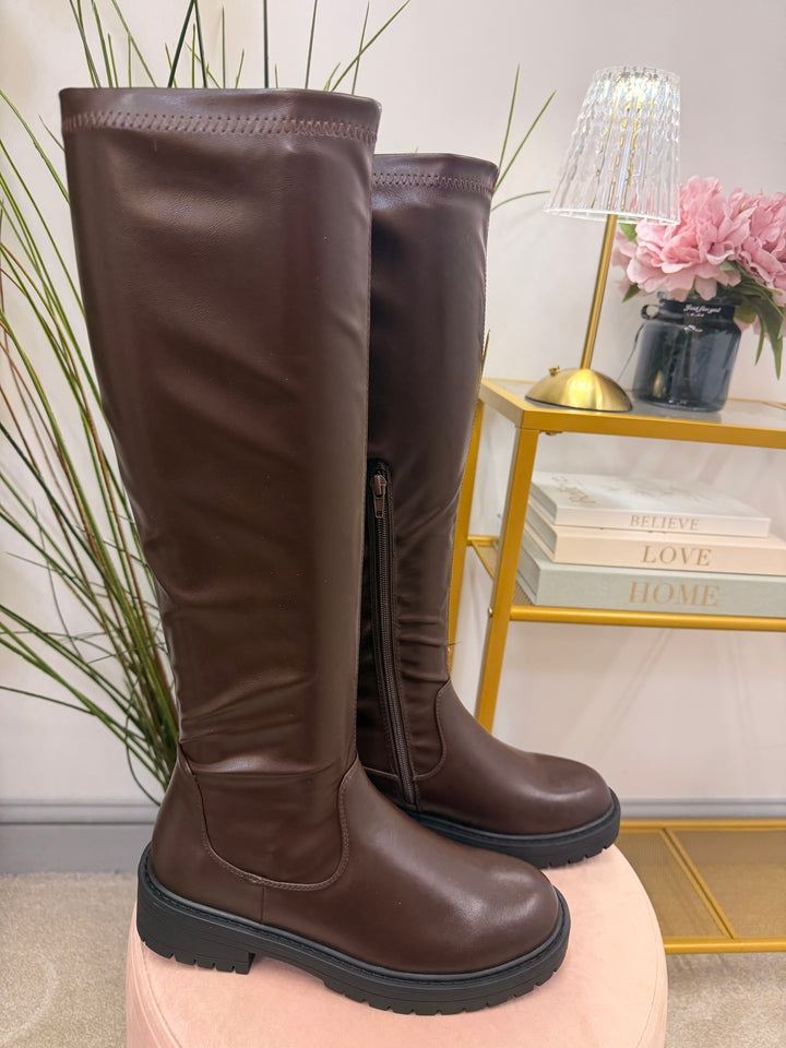 The NICOLA chocolate brown flat knee high stretch calf faux leather boots