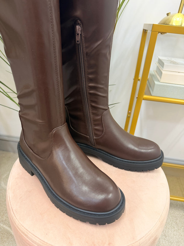 The NICOLA chocolate brown flat knee high stretch calf faux leather boots
