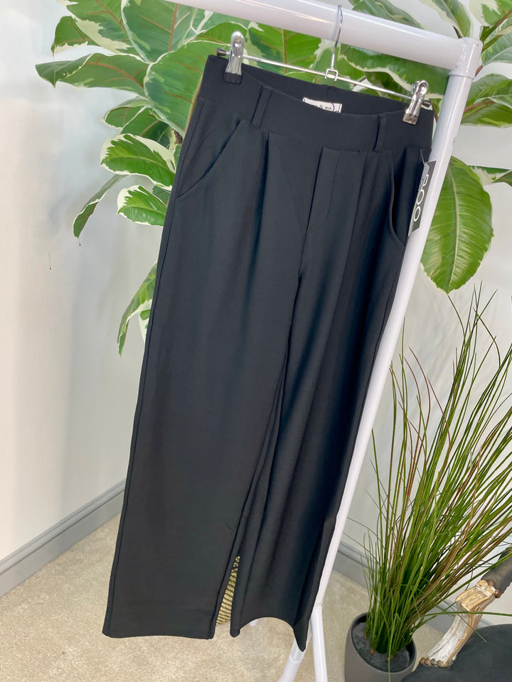 The DITA black trousers