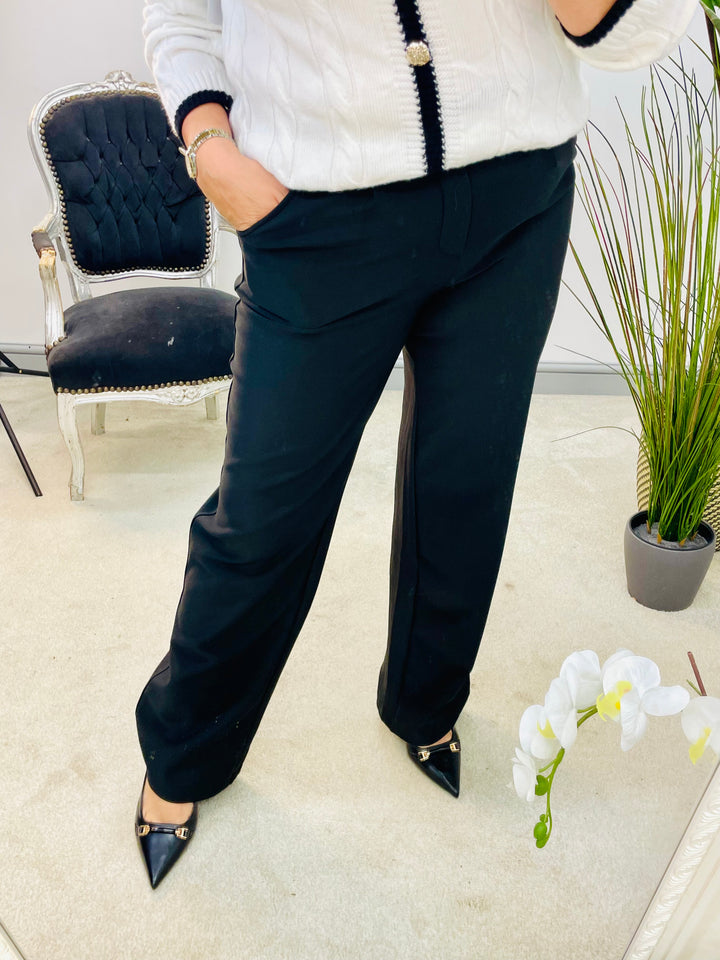 The DITA black trousers